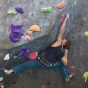 A man climb the Rec Center rock wall